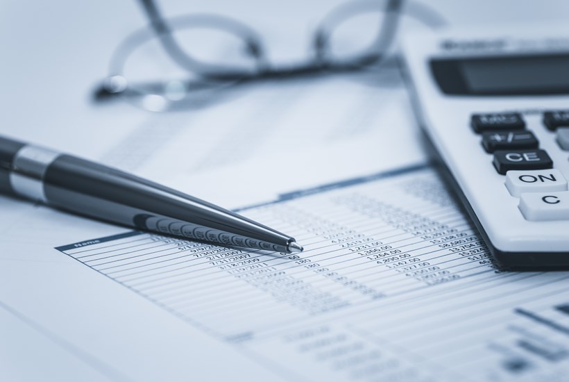 Accounting-financial-audit-bank-banking-account-stock-spreadsheet-data-with-glasses-pen-and-calculator-in-washed-blue-monochrome-financial-concept-for-analysis,-audit-finance-forensics-856493562_3869x2580